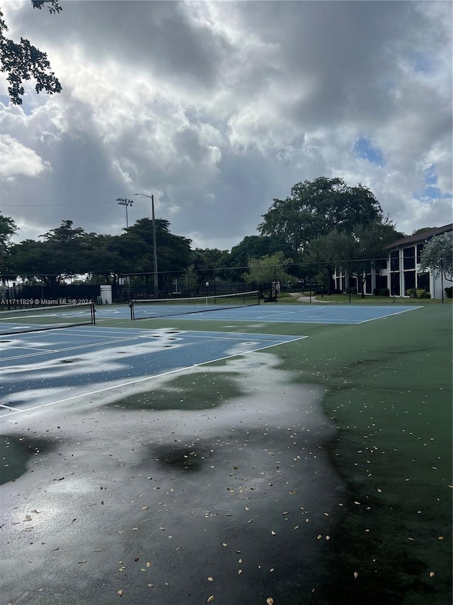 view of sport court with tennis court