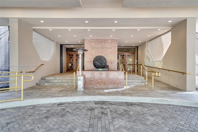 11113 Biscayne Blvd Unit 255, Miami, FL 33181 - unfurnished living room with recessed lighting and stairs