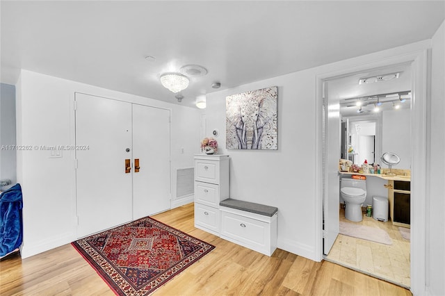 11113 Biscayne Blvd Unit 255, Miami, FL 33181 - entryway with light wood-style flooring and track lighting