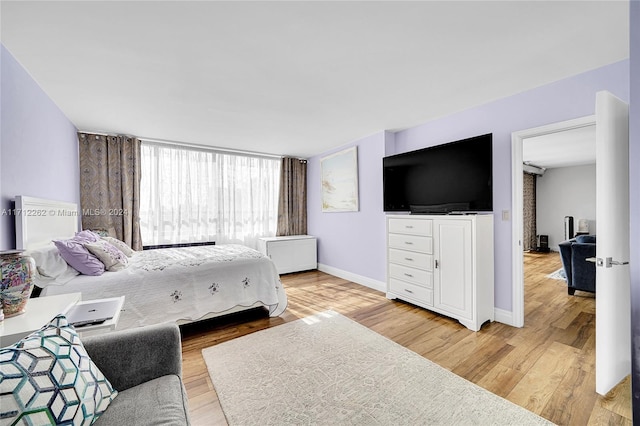 11113 Biscayne Blvd Unit 255, Miami, FL 33181 - bedroom with light wood-style flooring and baseboards