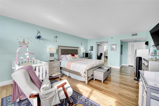 bedroom with light wood-type flooring