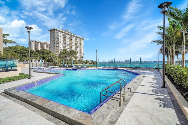 view of swimming pool with a patio