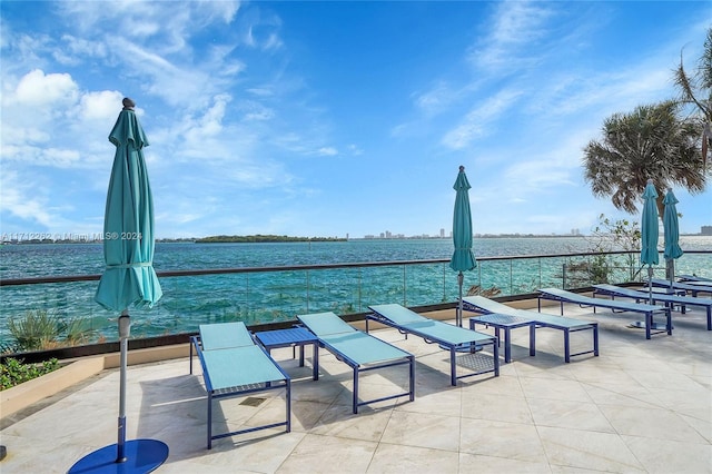 view of patio featuring a water view