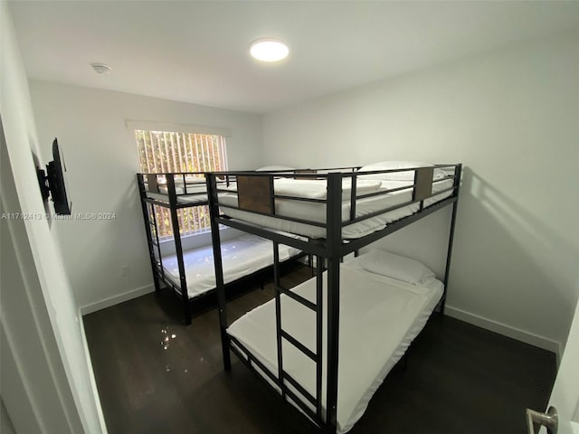 bedroom featuring dark hardwood / wood-style floors