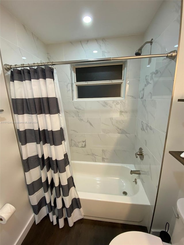 bathroom with shower / bath combination with curtain, toilet, and hardwood / wood-style floors