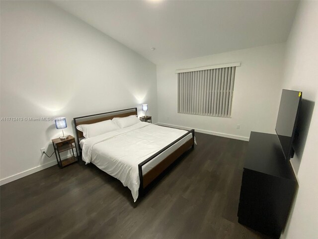 bedroom featuring dark wood-type flooring