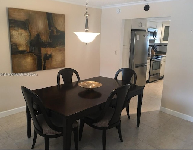 311 S Hollybrook Dr Unit 202, Pembroke Pines, FL 33025 - dining space with crown molding and light tile patterned flooring