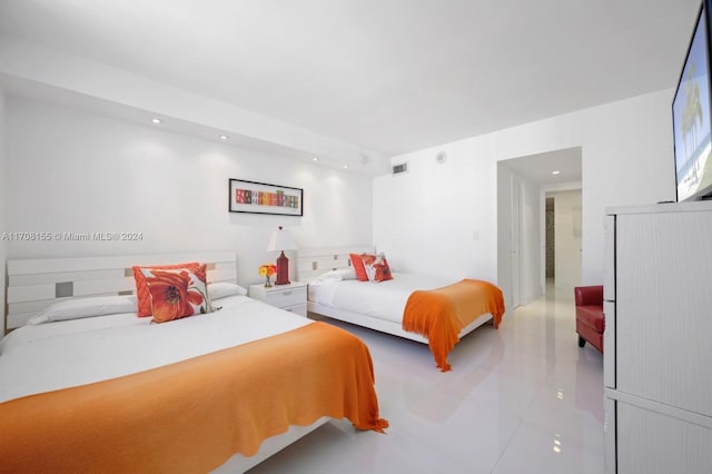 bedroom with light tile patterned floors