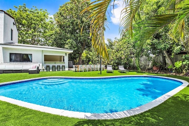 view of swimming pool featuring an outdoor living space and an outdoor bar