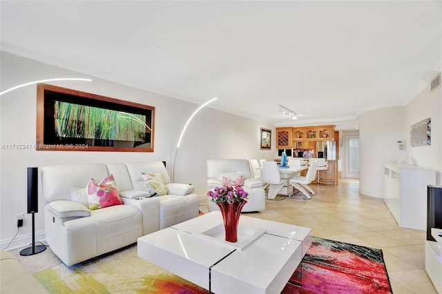 tiled living room with ornamental molding