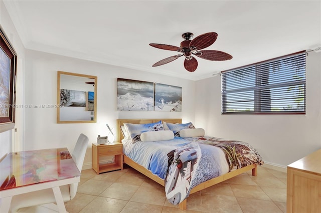 tiled bedroom featuring ceiling fan