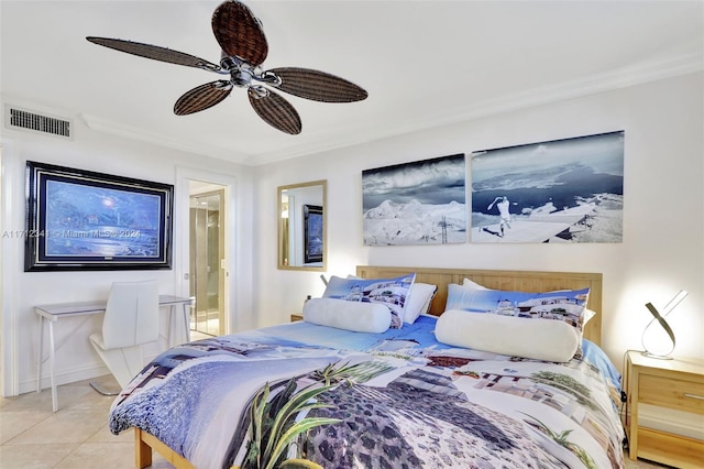 bedroom featuring ensuite bath, ceiling fan, light tile patterned floors, and ornamental molding