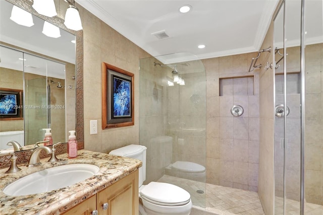 bathroom featuring vanity, crown molding, toilet, tile walls, and an enclosed shower