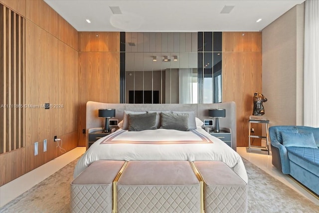 bedroom with wood walls