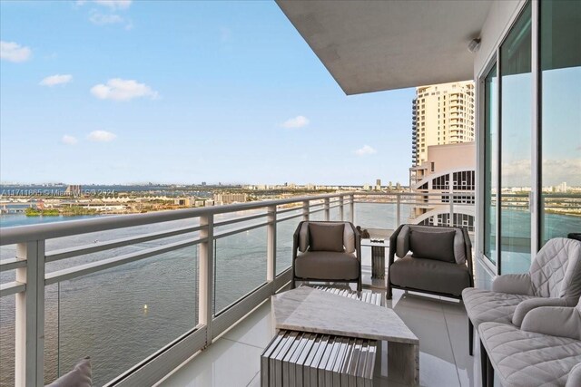 balcony featuring a water view