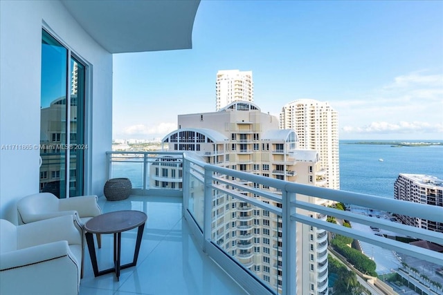 balcony featuring a water view