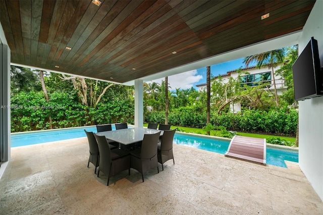 view of swimming pool featuring a patio area