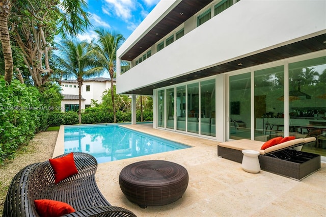 view of swimming pool featuring a patio