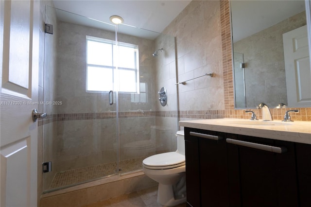 bathroom with tasteful backsplash, toilet, tile walls, and a shower with shower door