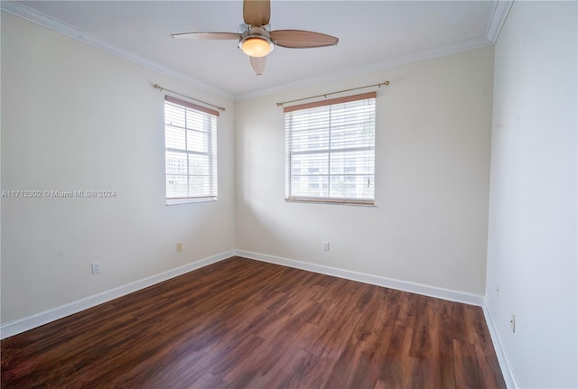 empty room with dark hardwood / wood-style floors, ceiling fan, and crown molding