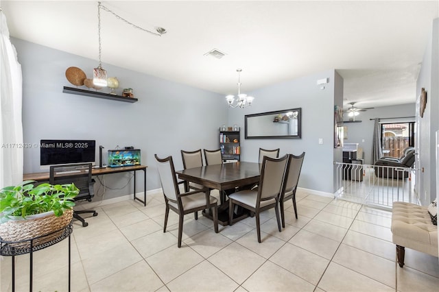 3217 SE 4th Ct Unit 3217, Homestead, FL 33033 - dining space with visible vents, ceiling fan with notable chandelier, baseboards, and light tile patterned flooring