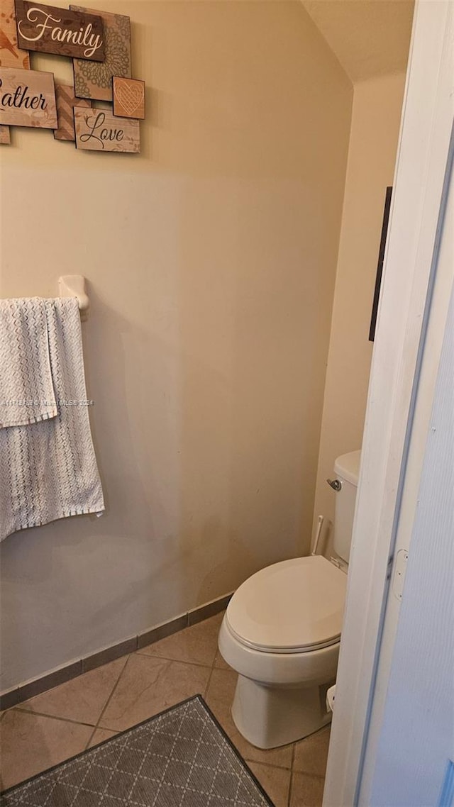 bathroom featuring tile patterned flooring and toilet