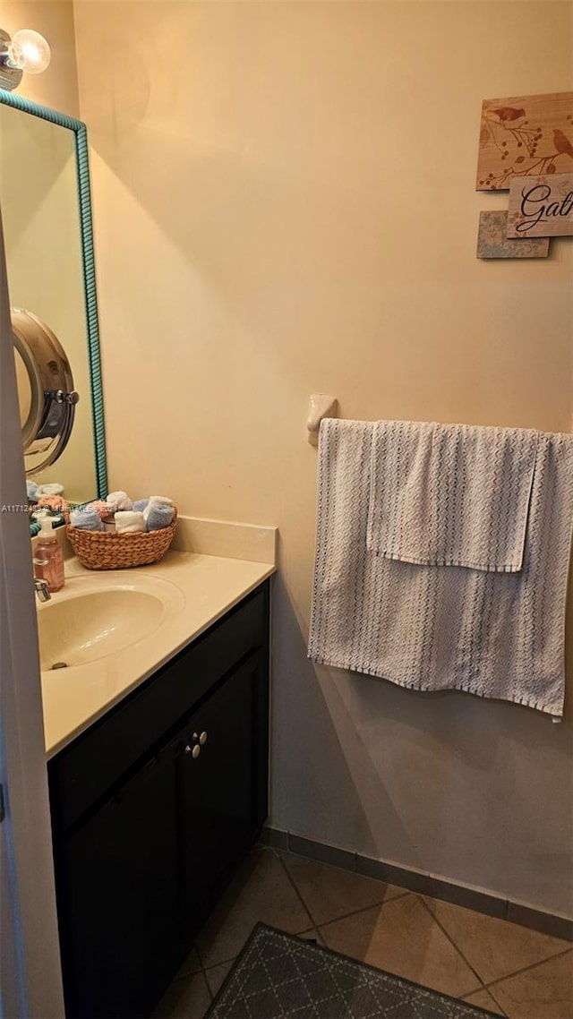 bathroom featuring tile patterned flooring and vanity