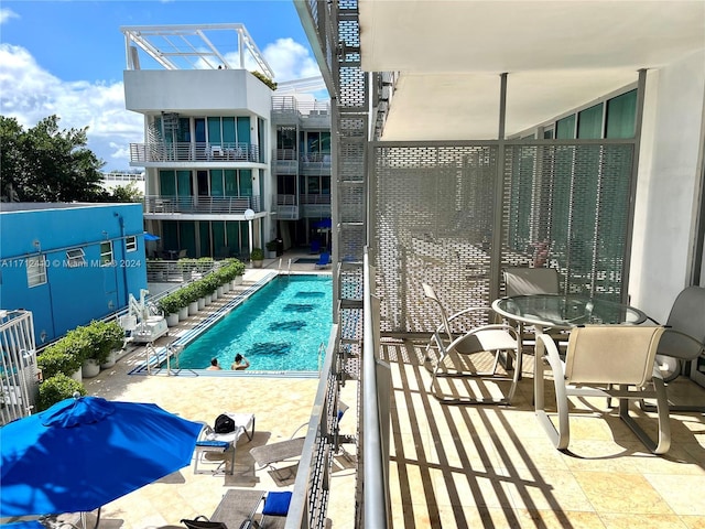 view of swimming pool with a patio area