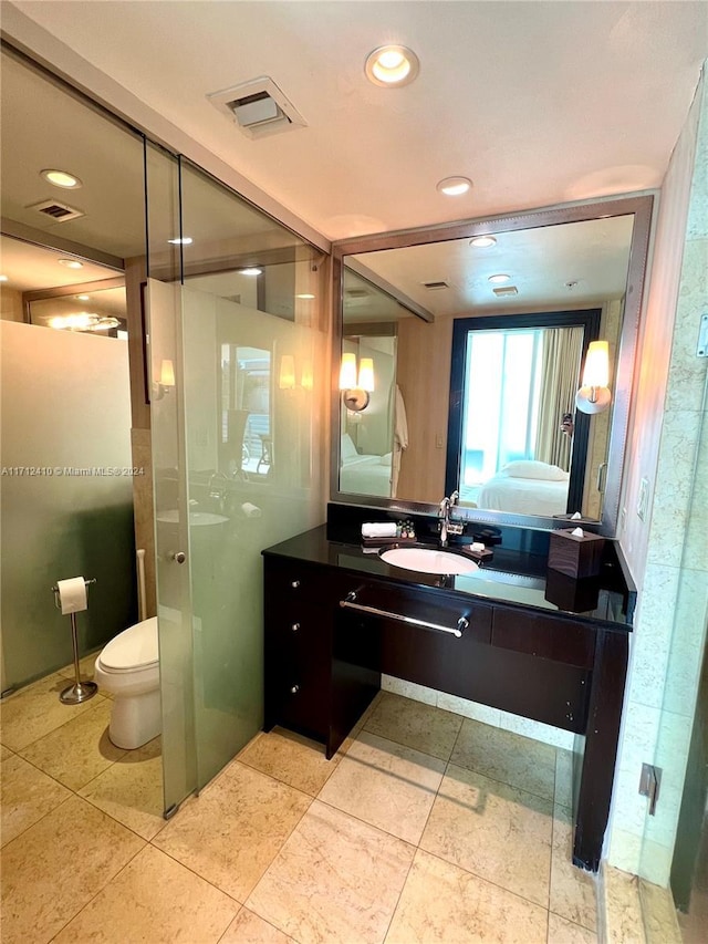 bathroom with vanity and toilet