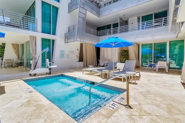 view of pool featuring a patio