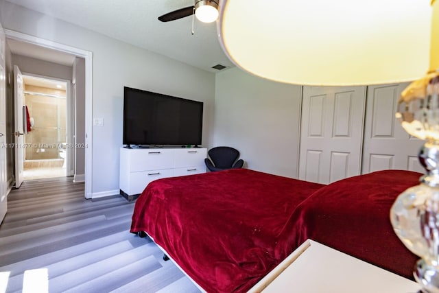 bedroom featuring hardwood / wood-style flooring and ceiling fan