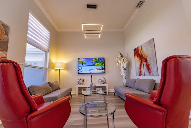 living room featuring hardwood / wood-style floors and ornamental molding