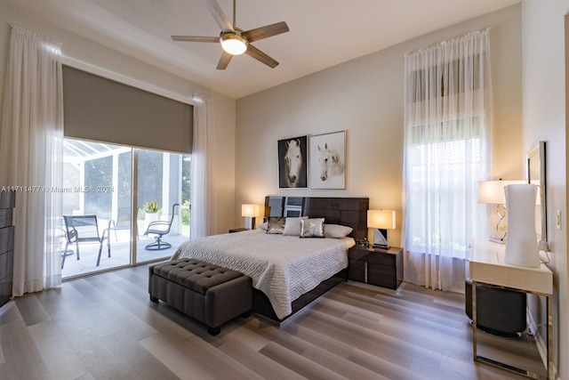 bedroom with access to outside, ceiling fan, and light hardwood / wood-style floors