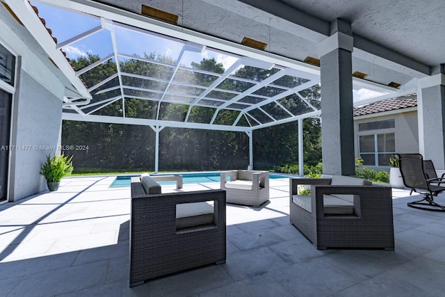 view of patio with glass enclosure and a pool with hot tub