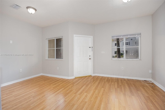 spare room featuring light hardwood / wood-style floors