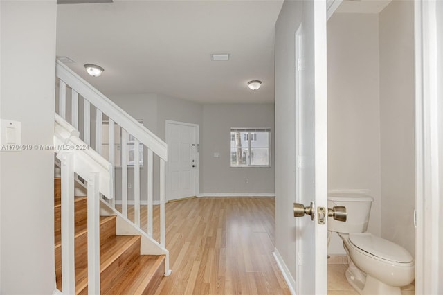 foyer entrance featuring hardwood / wood-style floors