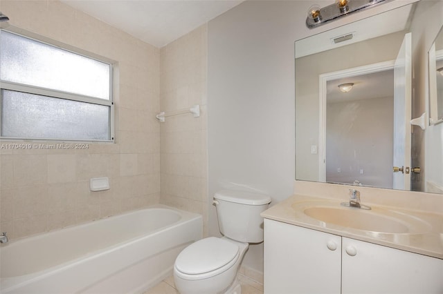 full bathroom with tile patterned flooring, vanity, toilet, and tiled shower / bath combo