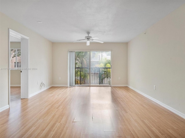 spare room with ceiling fan and light hardwood / wood-style floors