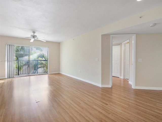 unfurnished room featuring ceiling fan and light wood-type flooring