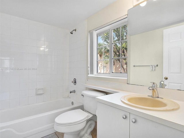 full bathroom with vanity, toilet, and tiled shower / bath combo