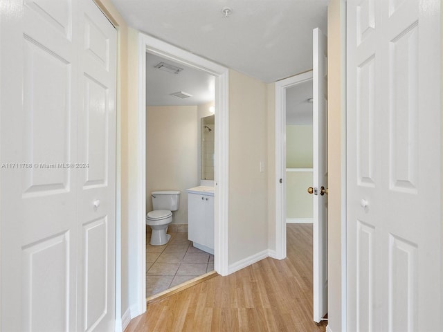 hall with light wood-type flooring