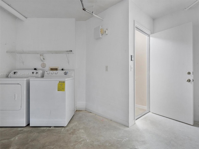 washroom featuring washing machine and dryer