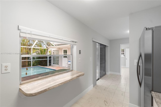 kitchen featuring stainless steel refrigerator