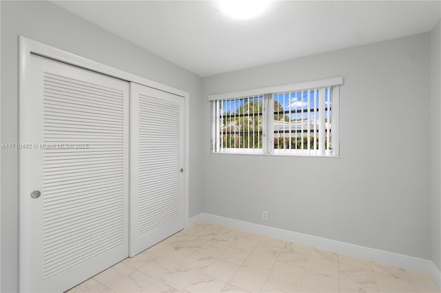 unfurnished bedroom with a closet