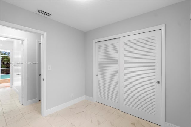unfurnished bedroom with a closet