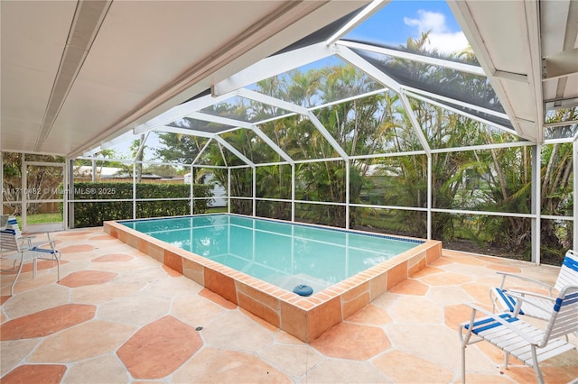 view of pool with a lanai and a patio