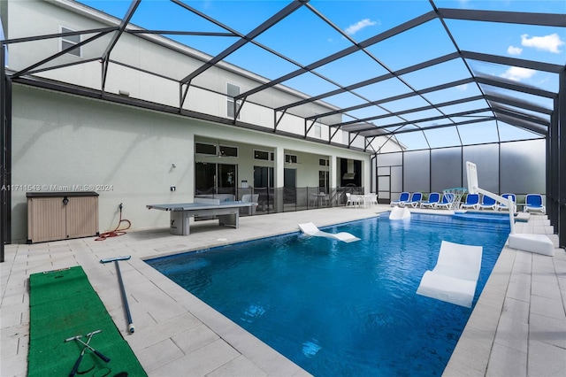 view of pool featuring a lanai and a patio