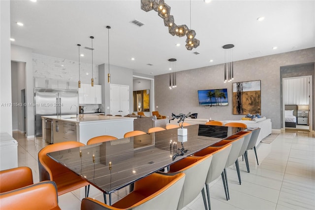 tiled dining area featuring sink