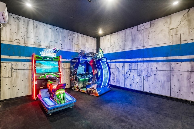 playroom with dark carpet, a textured ceiling, and a wall unit AC