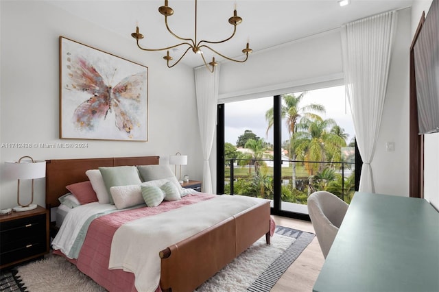 bedroom with an inviting chandelier, light wood-type flooring, access to outside, and multiple windows